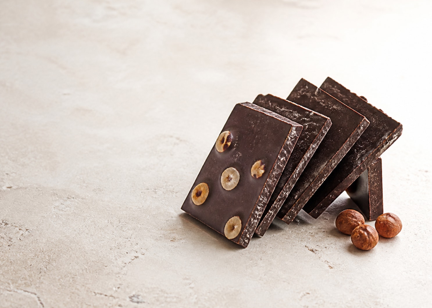 Artisan dark chocolate slabs with hazelnuts